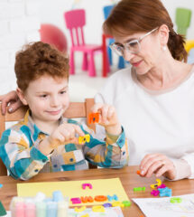 Occupational therapist and little boy